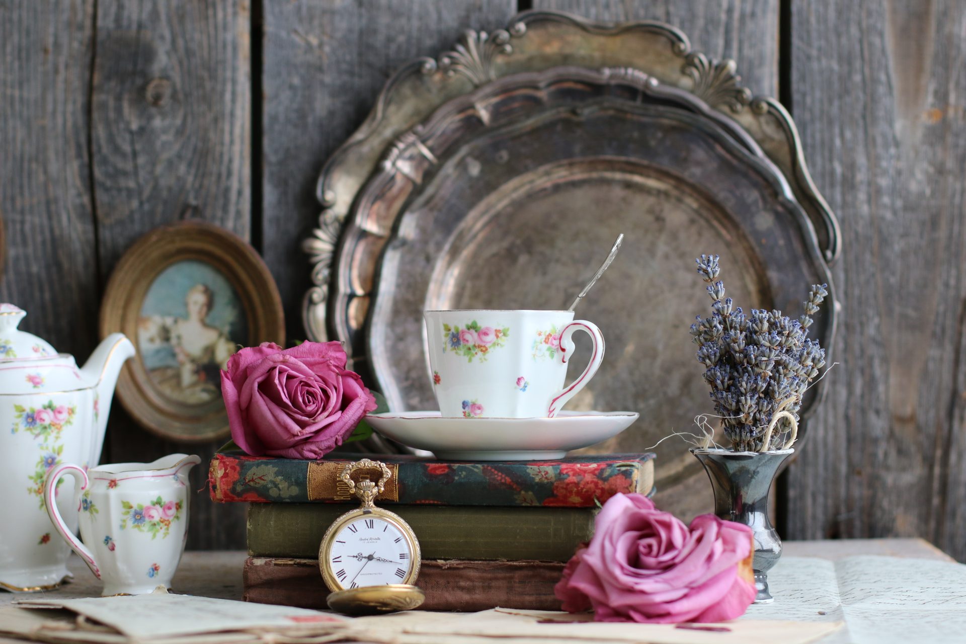 Vintage tea set with roses and books.