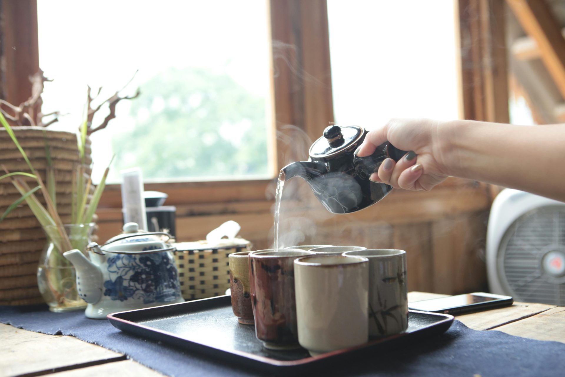 Cozy tea pouring scene.